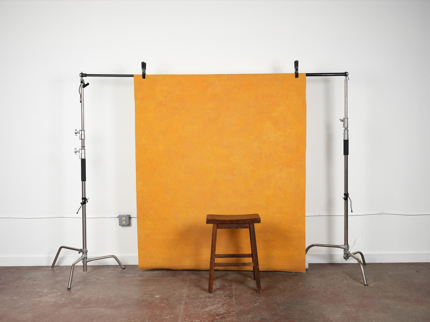 Yellow seamless backdrop with stool